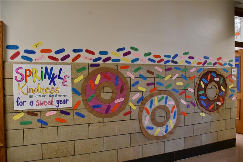paper donuts line the walls with colorful paper sprinkles 