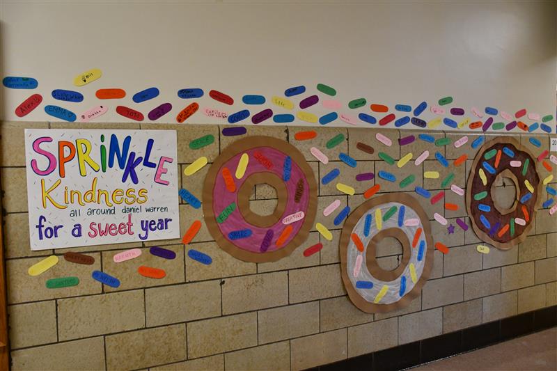 paper donuts line the walls with colorful paper sprinkles 