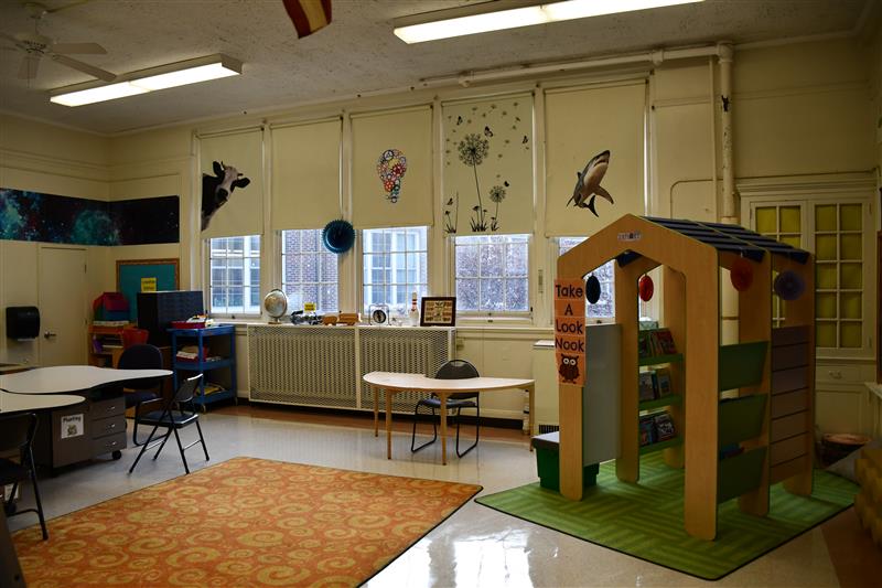 picture of a classroom with a playhouse inside
