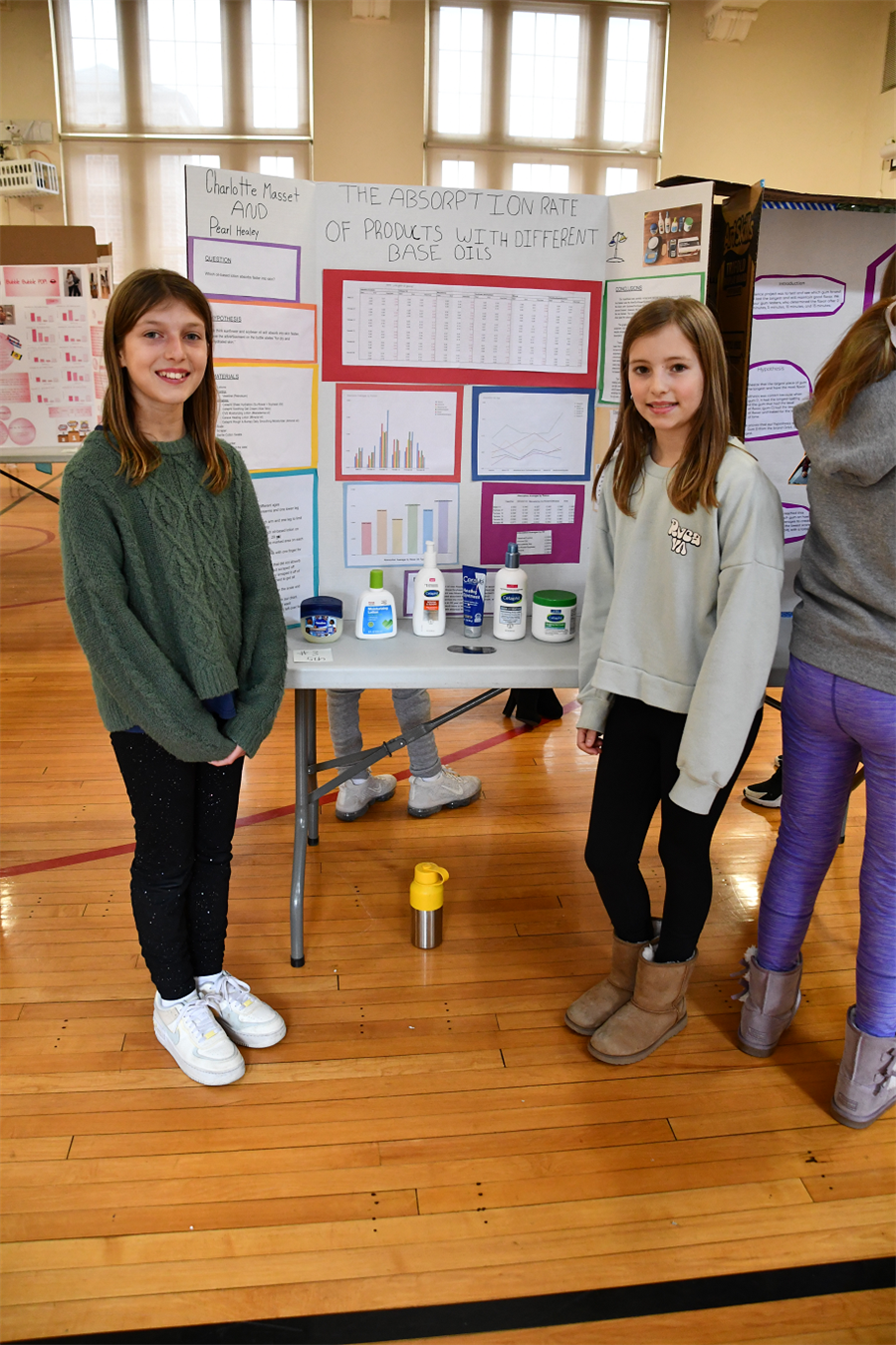 Students stand in front of experiment
